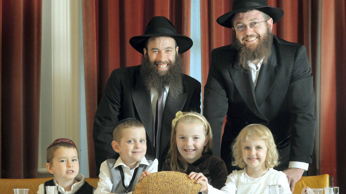 Rabbi Yochanan Gordon and Rabbi Avi Bendetsky with Sholom Gordon, 4, Yosya Bendetsky, 6, Baila Dolnikov, 8, and Rochel Bendetsky, 5. Picture: MARK JESSER