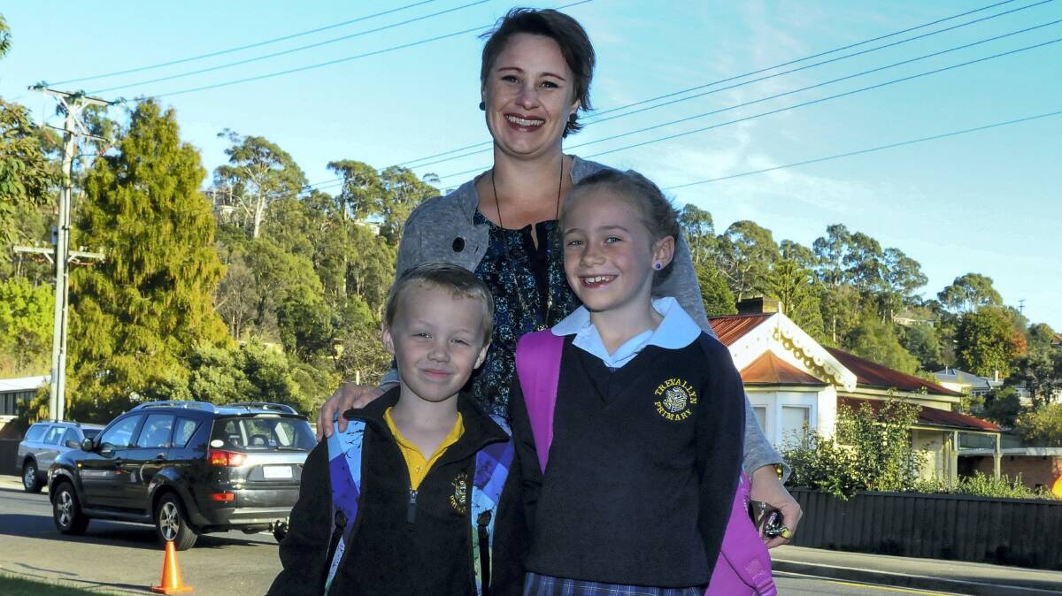 Tara Fox with children Willem, in kinder, and Loganne, in grade 3, return for term 2 at Trevallyn Primary School. Picture: NEIL RICHARDSON