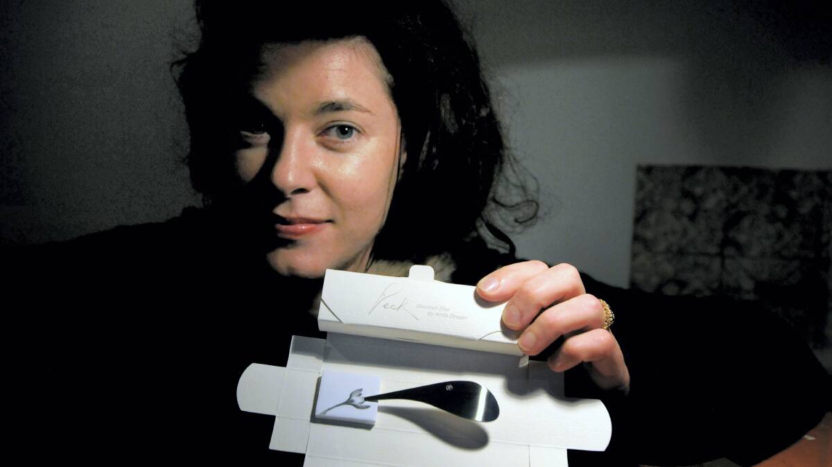 Launceston designer Anita Dineen with her 2014 Design Tasmania people's choice award-winning ``Peck'' gourmet tine. Picture: GEOFF ROBSON