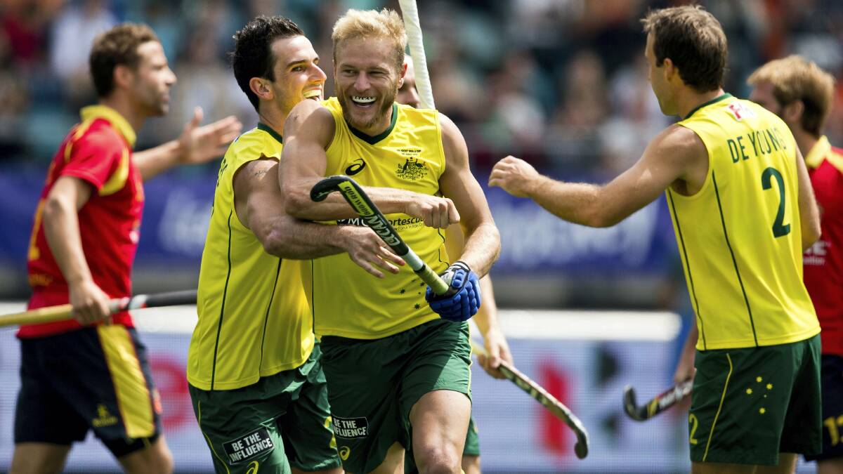 Launceston's Tim Deavin is congratulated by his Australian teammates after scoring a goal against Spain. Pictures:  GRANT TREEBY, www.treebyimages.com.au.
