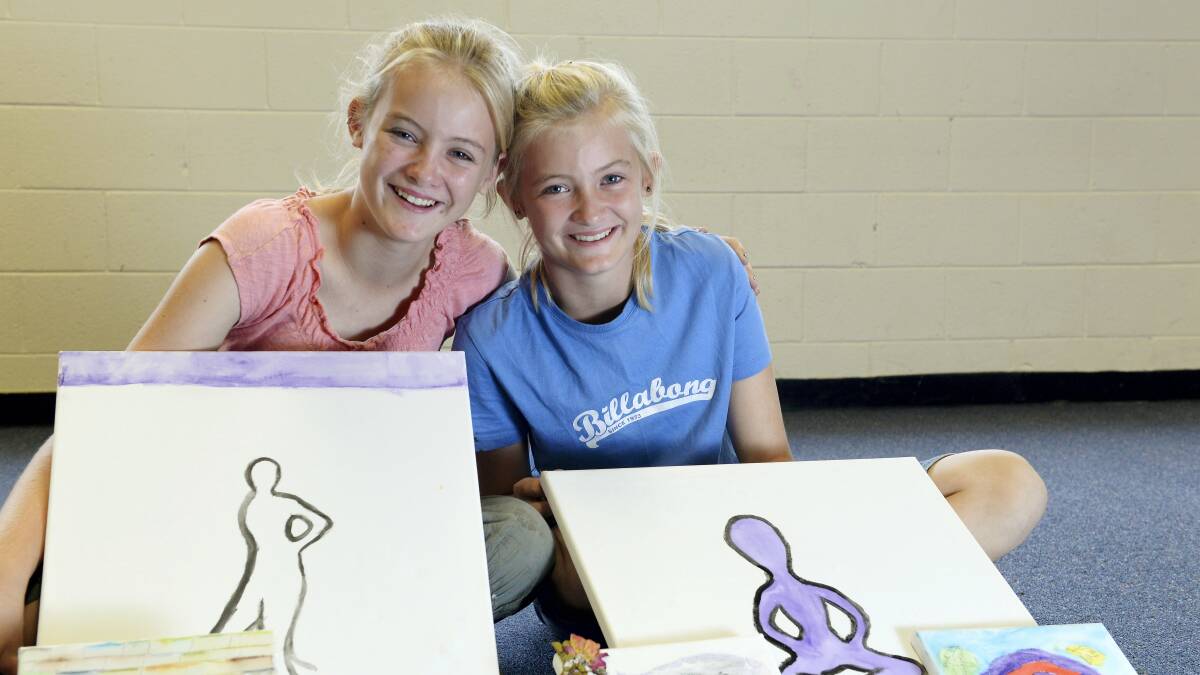 Twins Tahlia and Telia Donoghue, 12, at the art classes at Ravenswood Neighbourhood House.