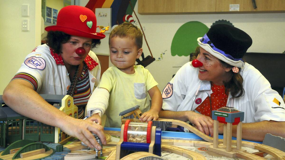 Clown Doctors Dr Dot (Leigh Tesch) and Dr Very Much (Tanya Maxwell) with Adz Lowe, 2, of Glengarry. Picture: PAUL SCAMBLER
