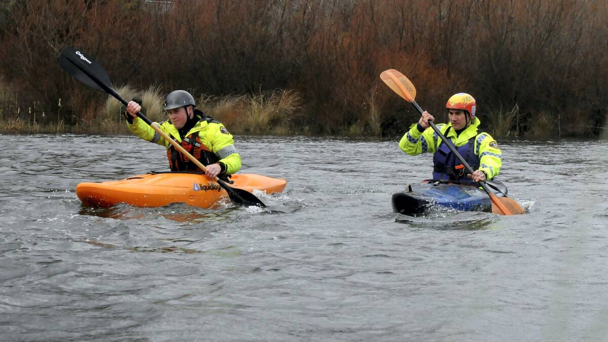 Police kayakers Senior Constable Ross McIvor and Constable Dan Smith search the South Esk River on Monday for any signs of missing Launceston man Ben Wara Plowright.  Picture: NEIL RICHARDSON.