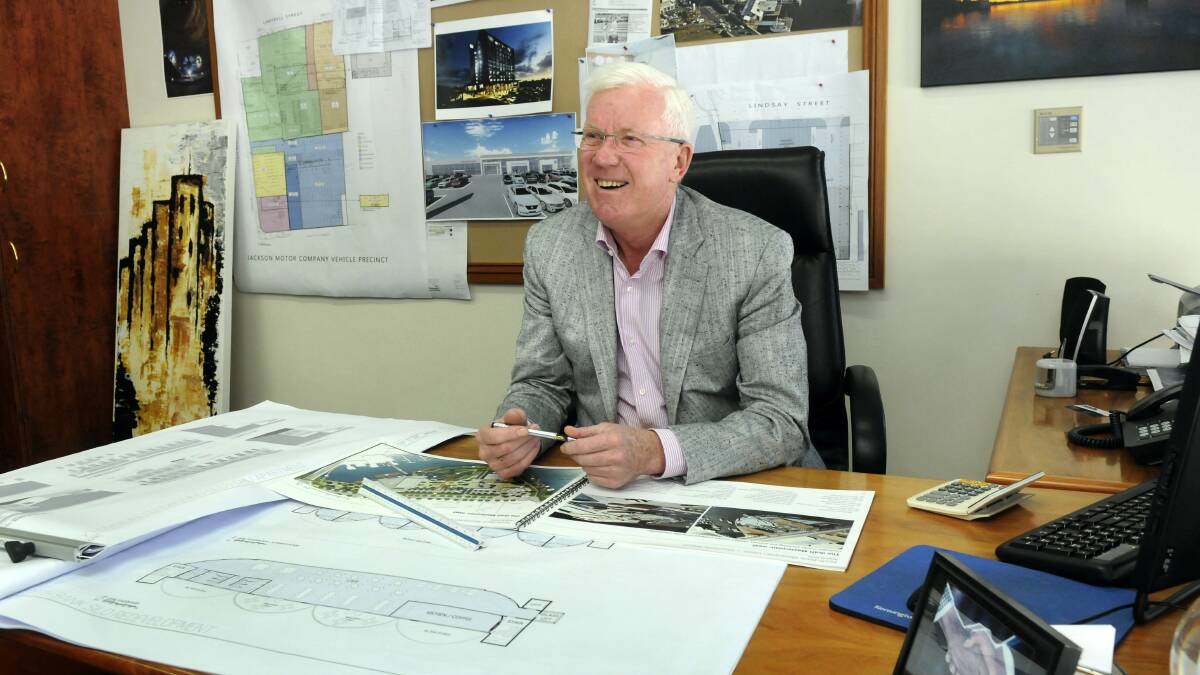 Errol Stewart working on plans in his office at the JMC Ford dealership in Launceston.Picture: PAUL SCAMBLER