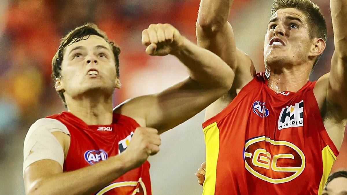 Launceston's Kade Kolodjashnij and his Gold Coast teammate Zac Smith leap for a mark during the side's victory over Geelong on Saturday. Picture: GETTY IMAGES