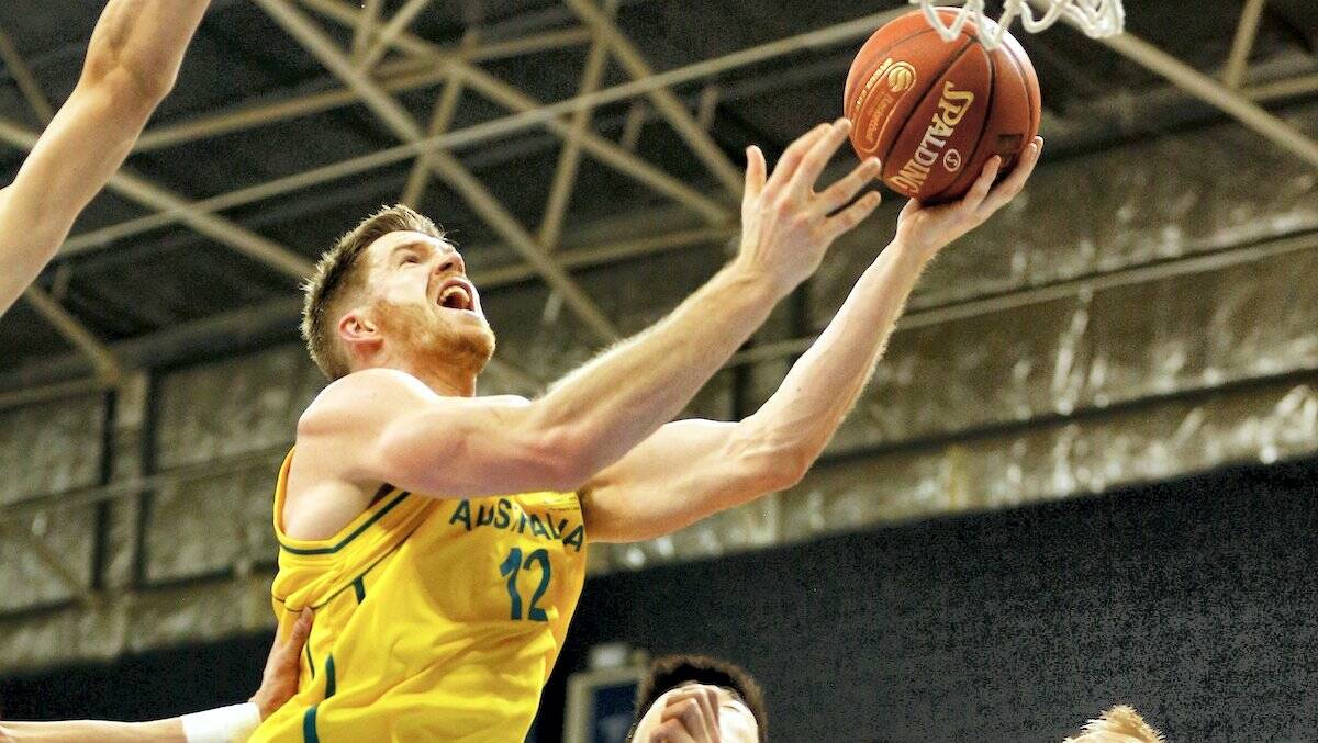 Lucas Walker goes to the basket for the Boomers in their final match against China on Sunday night.  Picture: TOMASZ GREGORCZYK

