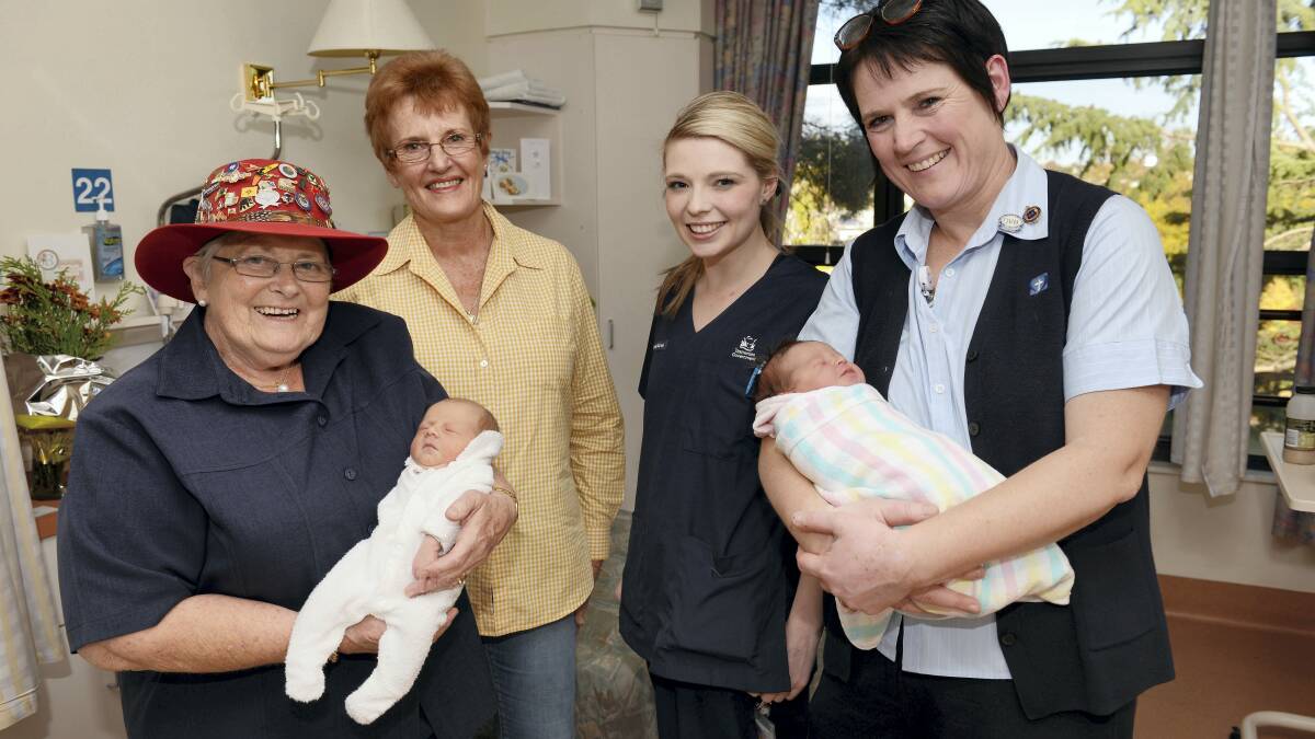 Retired midwife Elaine Smallbane, private practice midwife Anna Holloway, student midwife Arielle Stephenson and Calvary midwife Sue Davis with newborns, two-day-old Harleigh Aitken and one-day-old Sophia O'Toole.  Picture: SCOTT GELSTON
