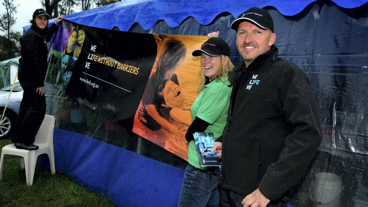 Sarah Pyka, Mel Ferrier and Tony Crothers, of  Life Without Barriers, set   up at  the Agfest site.  Life Without Barriers is  Agfest's Charity Partner of Choice.  Pictures: GEOFF ROBSON