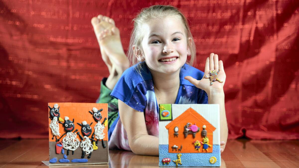 Lily Millwood, 8, is hoping to raise enough money to have her book The Rainbow Baby – which she designed and created out of plasticine – published. Picture: MARK JESSER