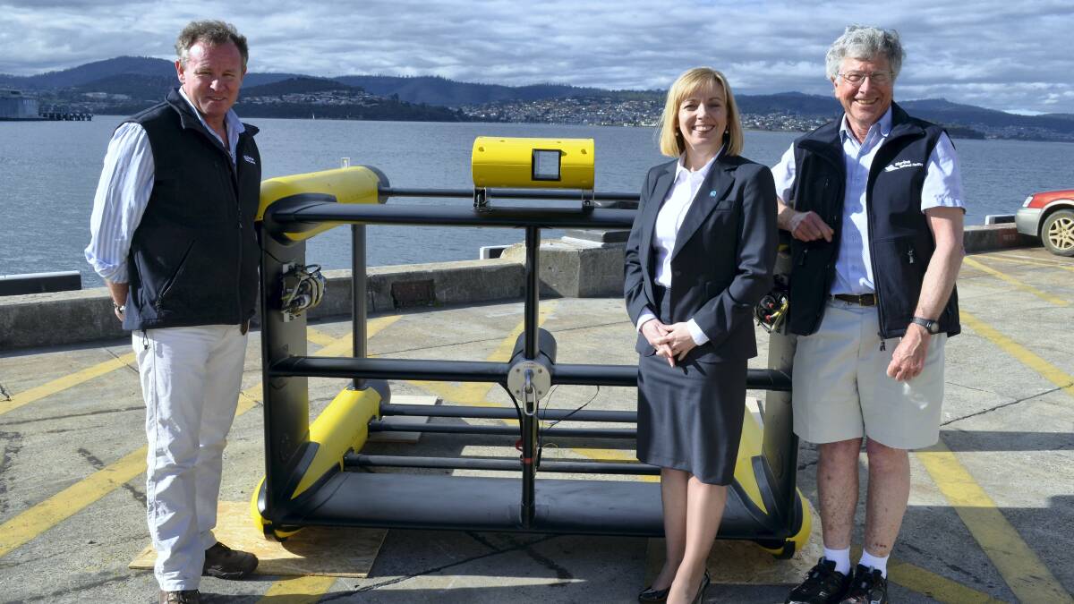 Marine National Facility operations officer Max Maguire, Future Research Vessel executive director Toni Moate and CSIRO scientist Dr Lindsay Pender with the Triaxus, a piece of equipment set to be towed by the  CSIRO’s new research boat.
