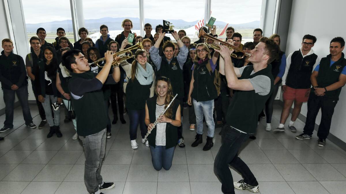 St Patrick's band members Frank Cui, Montana Chugg and Lucas Cairns sound out the celebration. Picture: NEIL RICHARDSON
