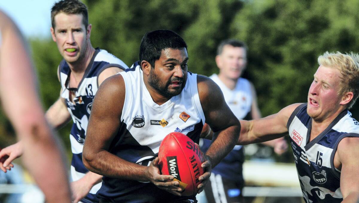 Old Launcestonians’  Ramesh Sundra is about to be tackled by  Tamar’s Luke Brockman  in yesterday’s elimination final. 