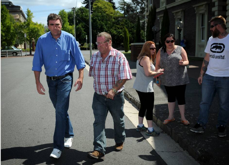 John Flanagan, husband of Maureen Flanagan who was killed when the car she was driving was hit by a vehicle being driven by David Johnathan Holmyard, and family friend Ron Adams leave court on Friday. Picture GEOFF ROBSON.