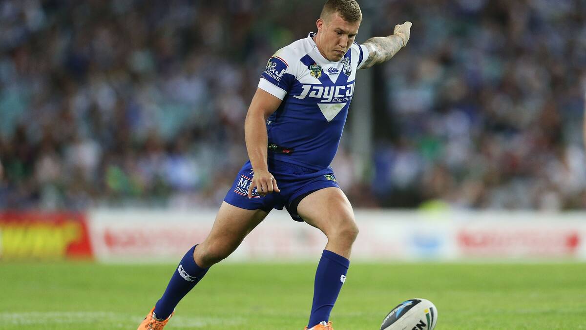 Trent Hodkinson of the Bulldogs kicks a penalty goal during the round seven NRL match between the South Sydney Rabbitohs and the Canterbury-Bankstown Bulldogs at ANZ Stadium on April 18, 2014 in Sydney, Australia. Photo: Mark Metcalfe/Getty Images.