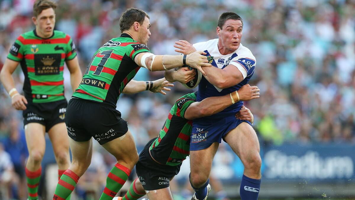 Josh Jackson of the Bulldogs is tackled during the round seven NRL match between the South Sydney Rabbitohs and the Canterbury-Bankstown Bulldogs at ANZ Stadium on April 18, 2014 in Sydney, Australia. Photo: Mark Metcalfe/Getty Images.