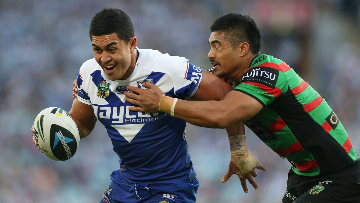 Tim Lafai of the Bulldogs is tackled by kirisome Auva'a of the Rabbitohs during the round seven NRL match between the South Sydney Rabbitohs and the Canterbury-Bankstown Bulldogs at ANZ Stadium on April 18, 2014 in Sydney, Australia. Photo: Mark Metcalfe/Getty Images.