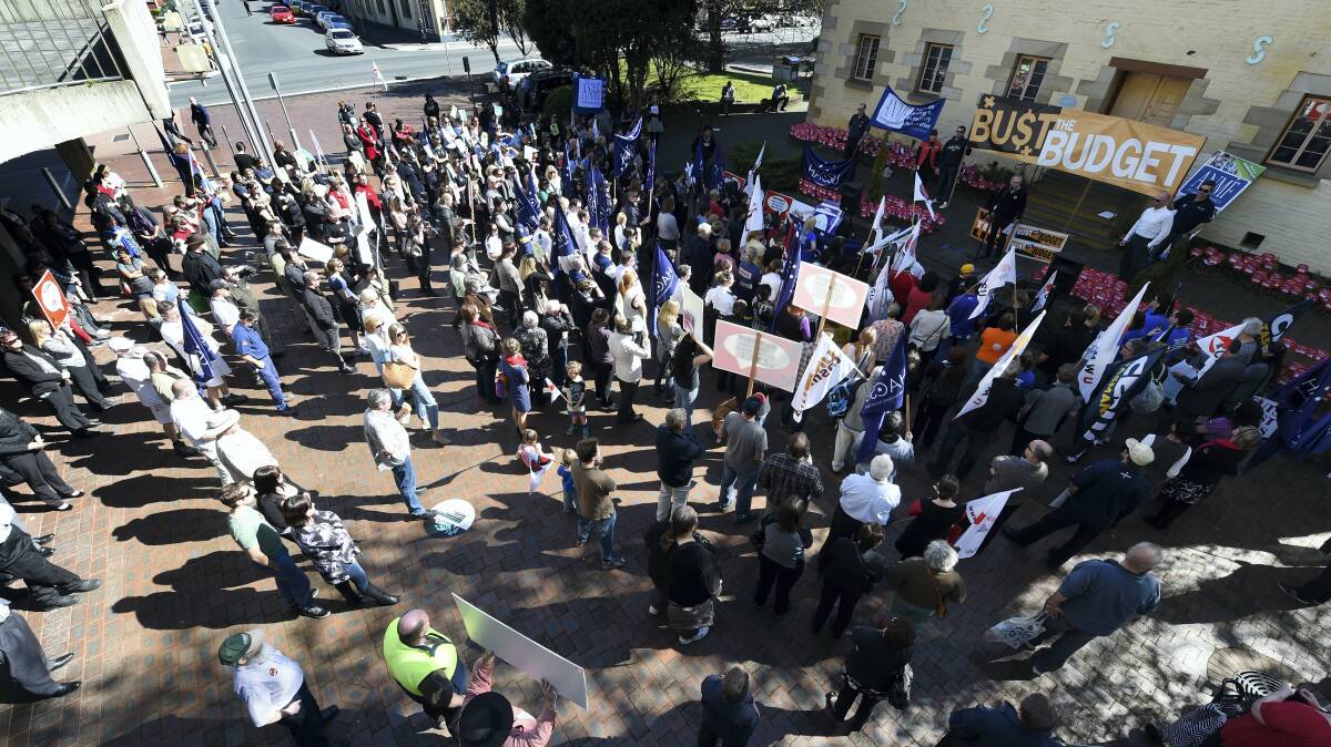 Protesters gathered in Launceston’s Civic Square yesterday to rally against proposed budget cuts.

 Picture: MARK JESSER