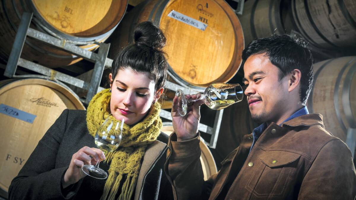 Alice Chugg, of Ethos in Hobart, and Hanz Gueco, of Cafe Paci in Sydney, wine tasting at Stoney Rise vineyard, Gravelly Beach. National finalists in the hospitality industry's Appetite for Excellence awards are touring Tasmania sampling local produce.  
