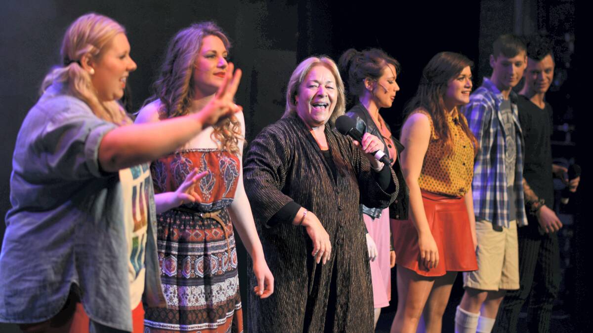 Australian pop star Colleen Hewett joins the cast for the encore of last night’s premiere of Newstead College’s production of Godspell.  Picture: SCOTT GELSTON
