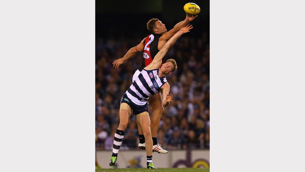 Tom Bellchambers and Geelong's Mark Blicavs contest in the ruck during the round seven AFL match between the Geelong Cats and the Essendon Bombers at Etihad Stadium last season.