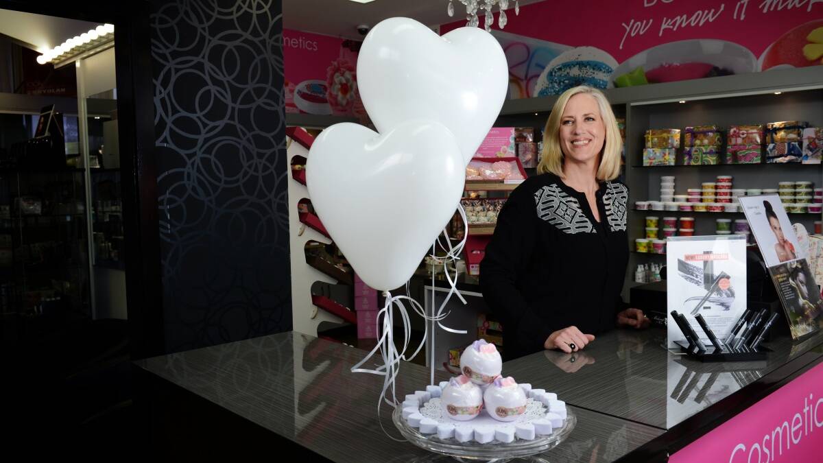 Make Up For You make-up artist Sam Rathmell with some of the bath bomb cosmetics being sold to raise funds for White Ribbon Day. Picture: Scott Gelston