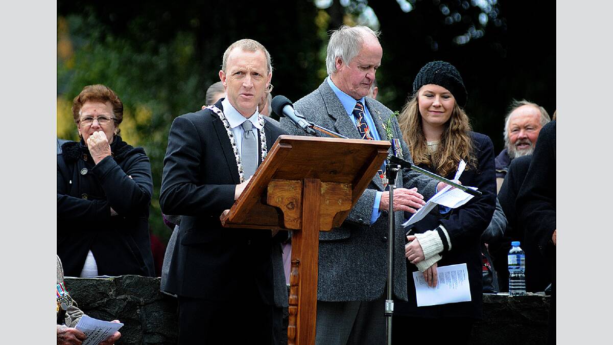 Meander Valley residents brave the cold to pay their respects at Deloraine today. Picture: GEOFF ROBSON.
