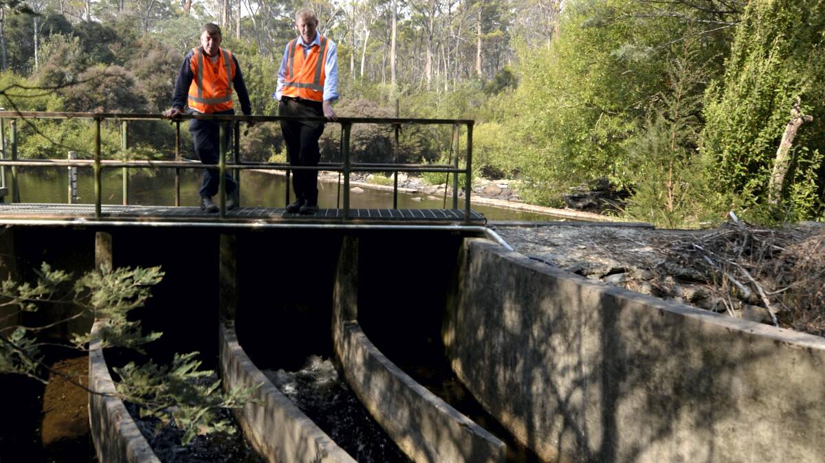 TasWater services operator Roger MacKenzie and urban treatment and pumping manager Matthew Leyton at the Nunamara Weir, pondering the water restrictions for Launceston. Picture: GEOFF ROBSON