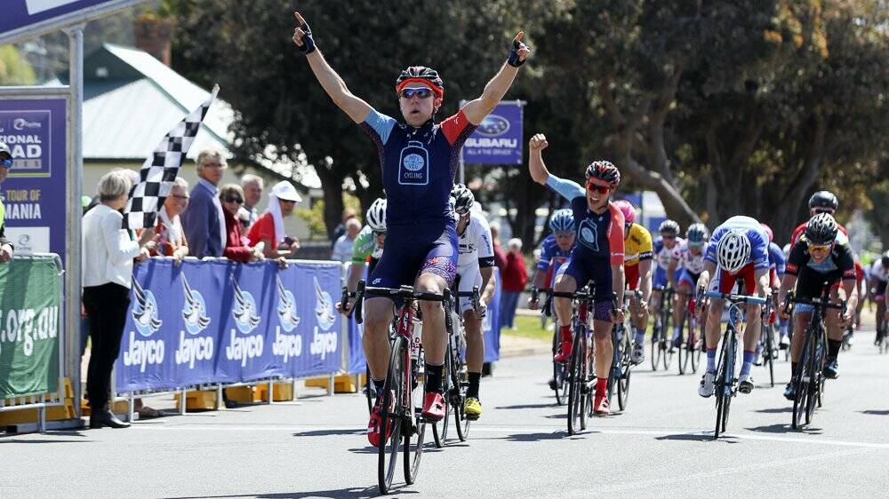 New Zealand’s Brad Evans outsprints Kiwi compatriot Joe Cooper to win stage two at Ulverstone and capture the  tour’s yellow jersey.