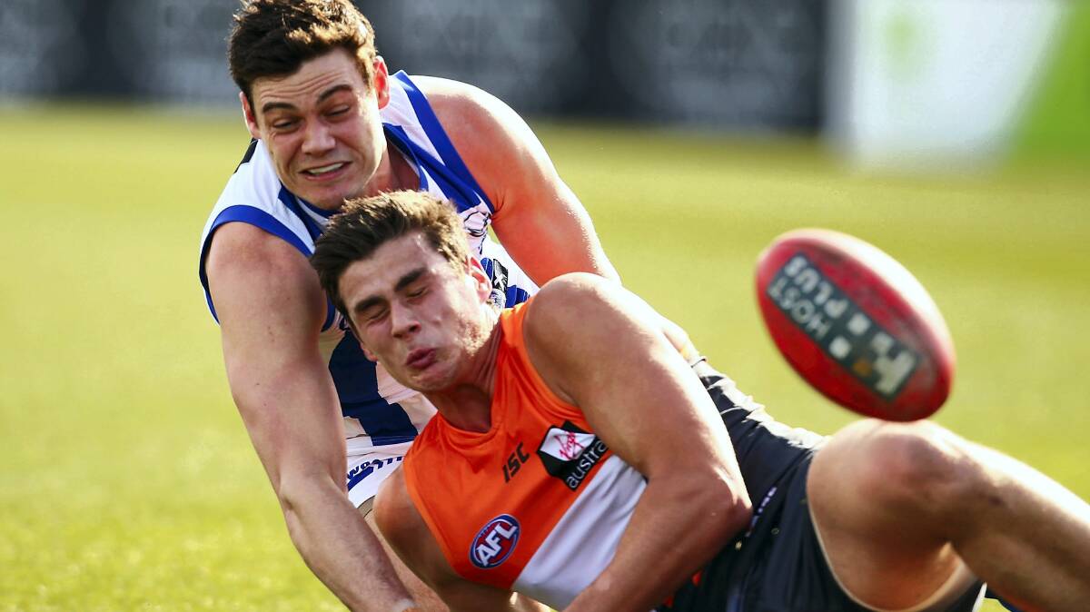 Kangaroo Nathan Grima puts presure on Giant Tom Boyd. Picture: GETTY IMAGES