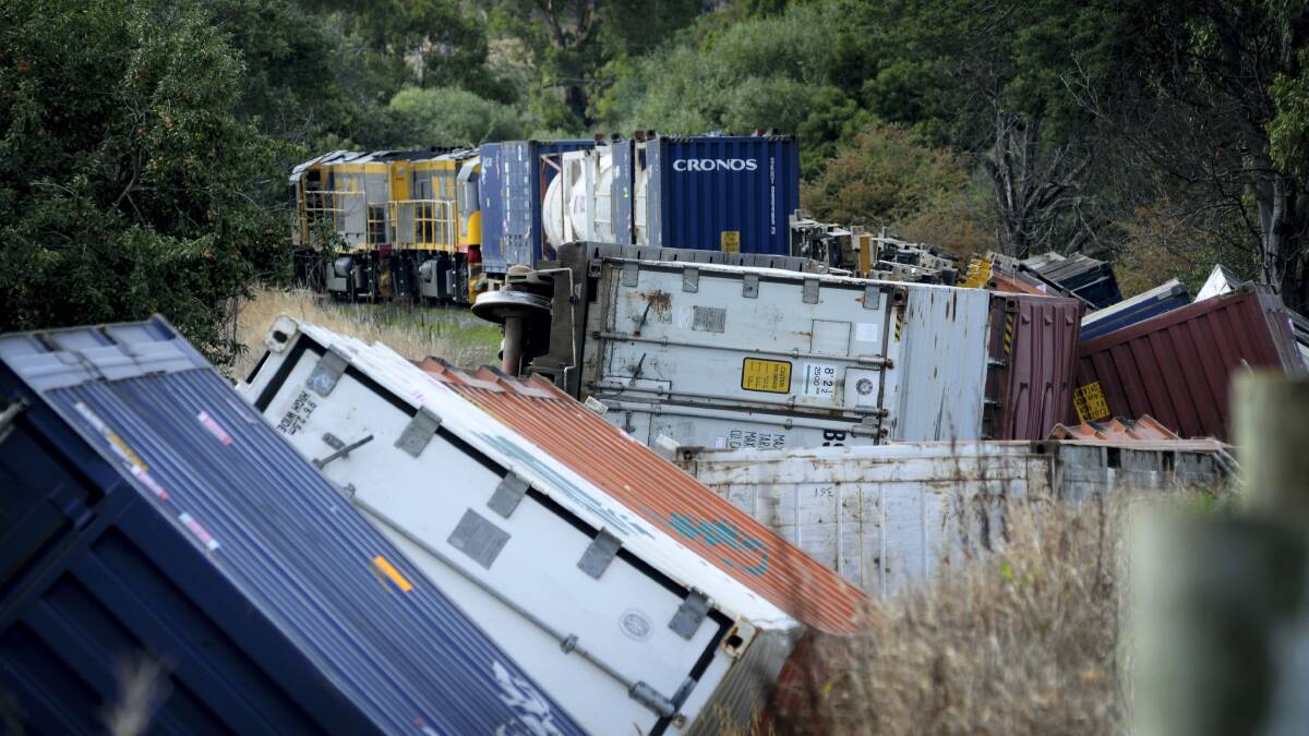 Some of the freight containers stranded after a TasRail train derailed at Kimberley on Sunday night.
Picture: GEOFF ROBSON

