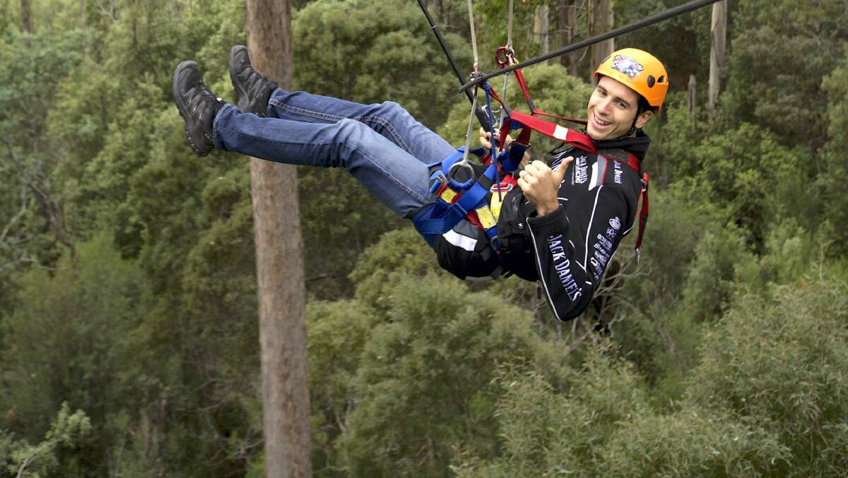V8 Supercar driver Rick Kelly got in touch with nature before this month's Tyrepower Tasmania 400, flying through the treetops at the Hollybank Treetops Adventure. Picture: PETER HARMSEN
