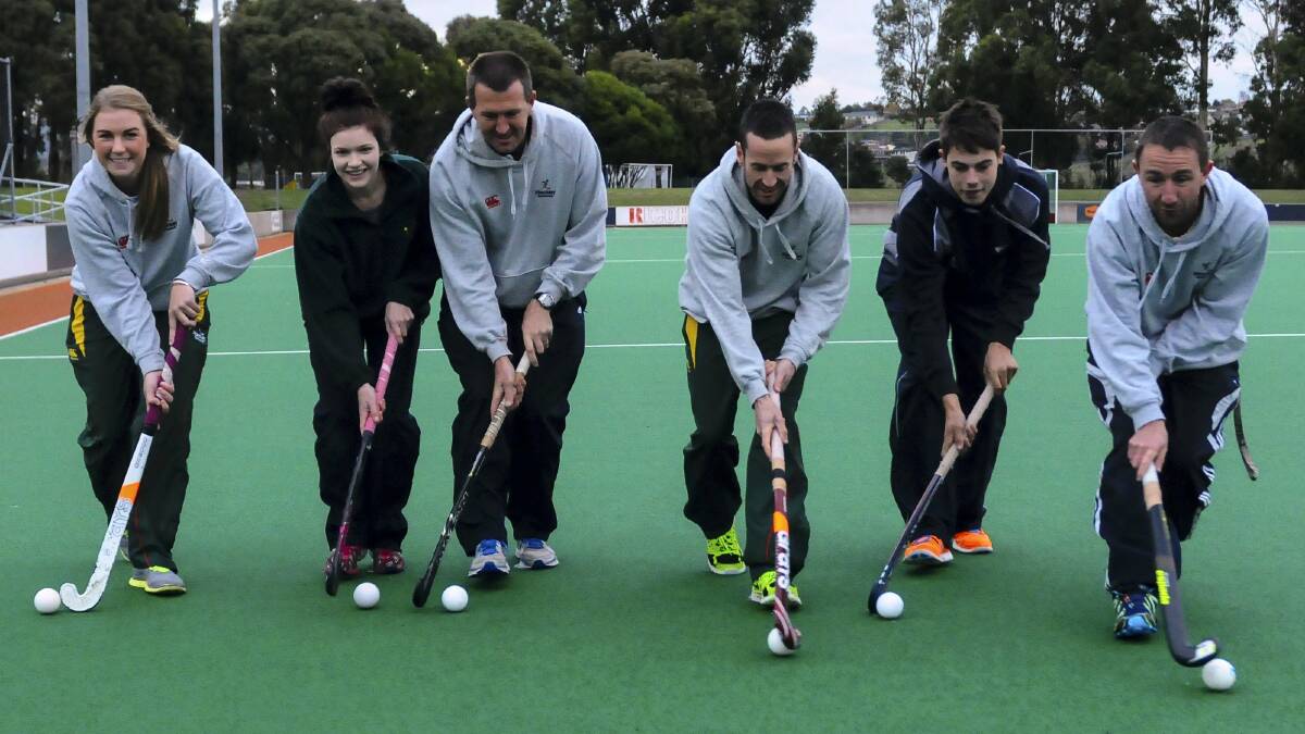 Ready to fly the flag for the North in the intrastate hockey 9s tournament  in Hobart at the weekend are Alissia Pearson, Miki Deavin, women's coach Colin Pearson, men's captain Brett Withington, Jai Walker-Kidd and men's coach Jeremy Stebbings. Picture: NEIL RICHARDSON