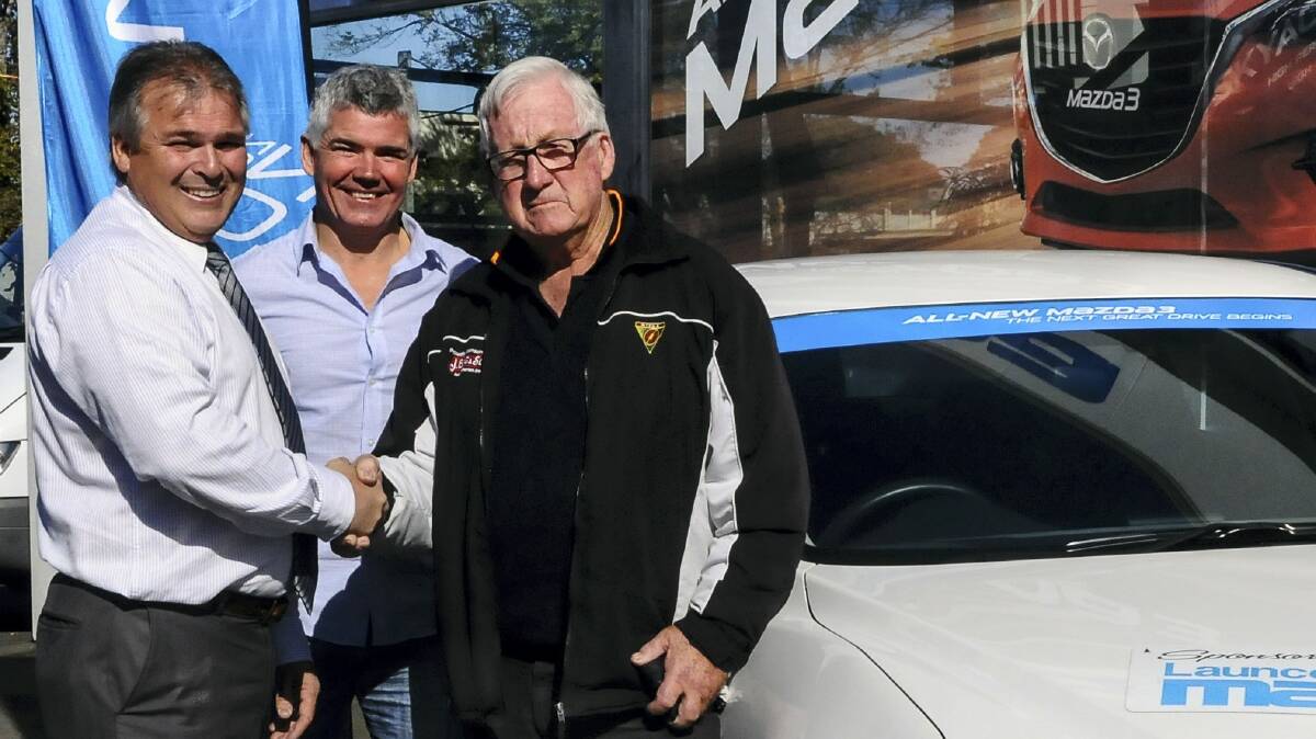 Launceston Motor Group managing director Grant Jenkins, The Examiner's Matt Wilson and car winner Jack Hinds, of Youngtown. Picture: NEIL RICHARDSON