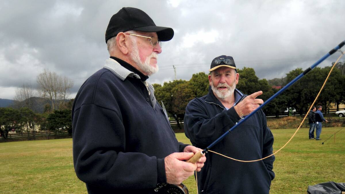 Gerald Arnold, of Westbury, chats to Jim Guy, of Launceston, about casting at the Quamby Fly Fishers open day.