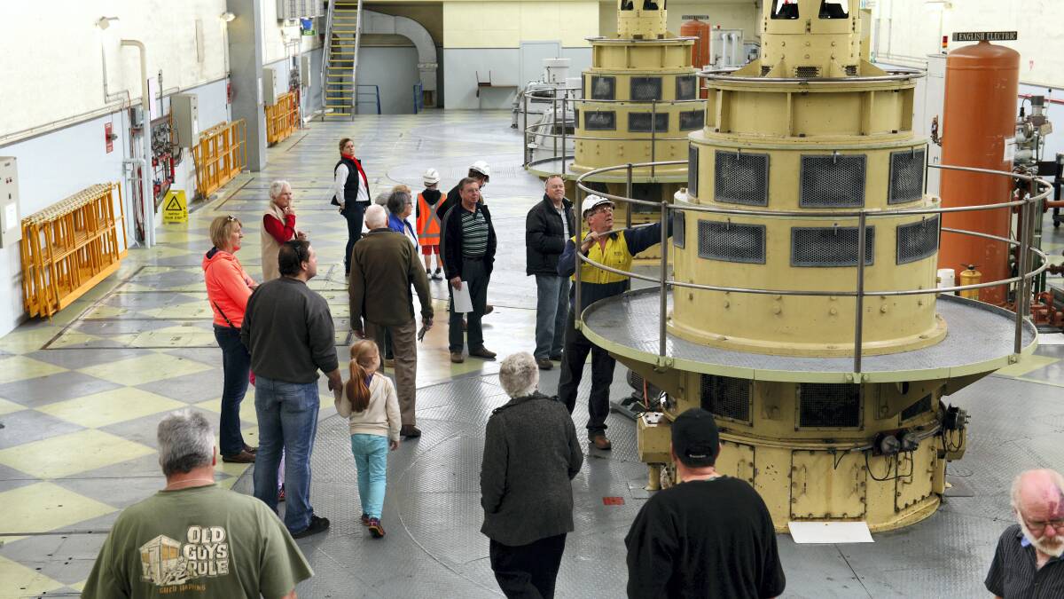 Production manager Michael Knowles leads the tour group through the Trevallyn Power Station. Picture: SCOTT GELSTON