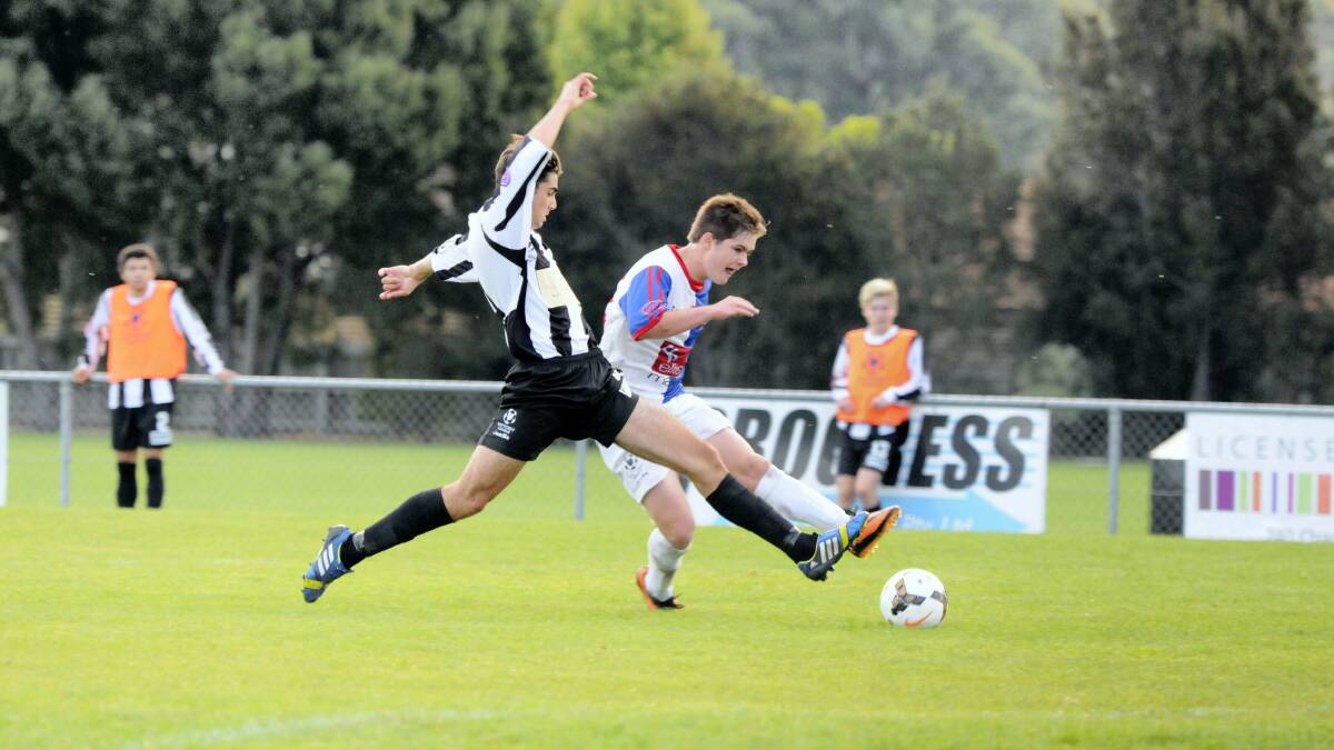 Launceston City's Dominic Rossi and Northern Rangers' Nick Lanua-Anderson contest the ball. Picture: MARK JESSER 