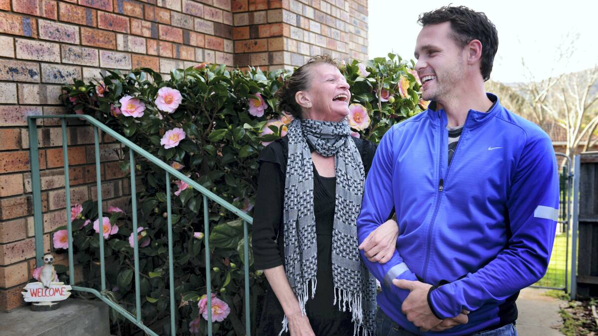 Daniel Geale takes a break from boxing training to catch up with him mum, Michelle, at her home at Rocherlea yesterday. Picture: SCOTT GELSTON