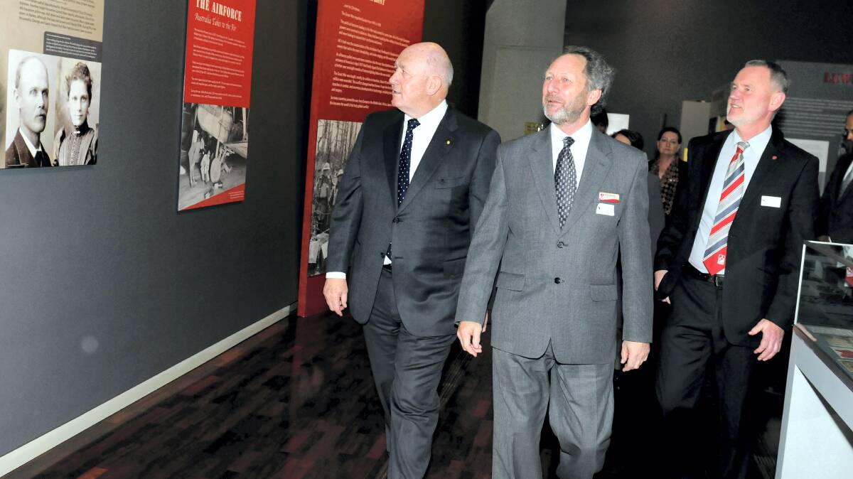 Governor-General Sir Peter Cosgrove, QVMAG director Richard Mulvaney and Launceston Mayor Albert van Zetten view the exhibition.  Picture: GEOFF ROBSON
