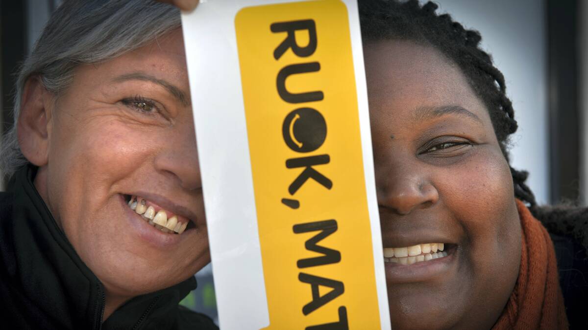 Headspace community liaison officer Alison Filgate and headspace project manager Dominique Smith with bumper stickers  for RUOK Day. Picture: PAUL SCAMBLER