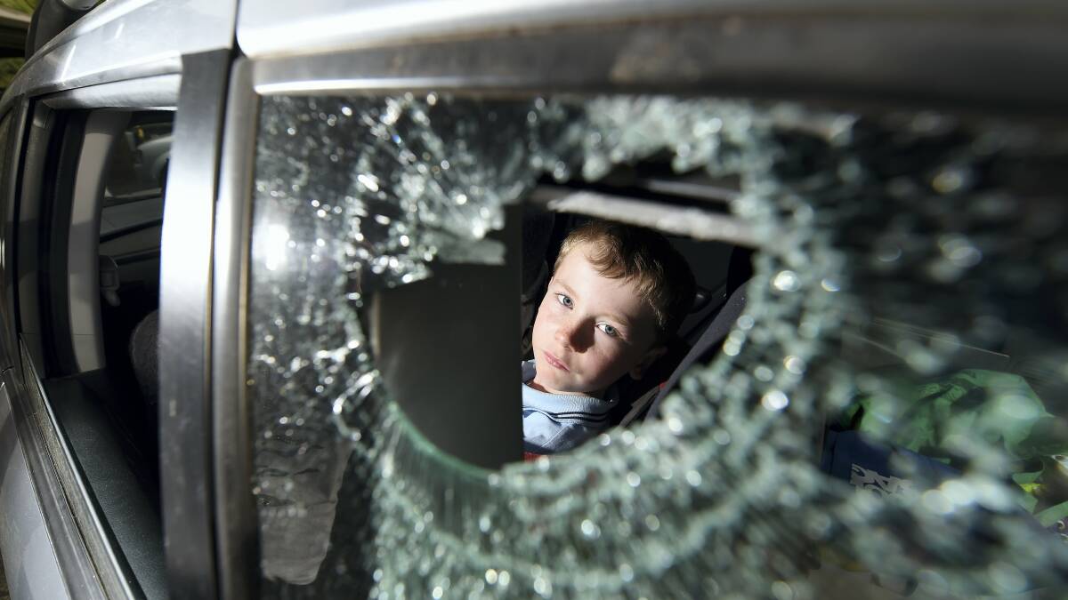 LGH nurse Julie Smedley was driving to work when something smashed her window. Her son Isaac Smedley, 7, sits in a booster seat on the passenger side of the car. Picture: MARK JESSER