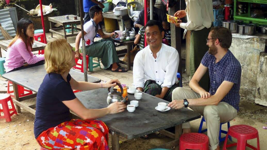 David Hale and partner Meg Berryman talk to locals in Myanmar.