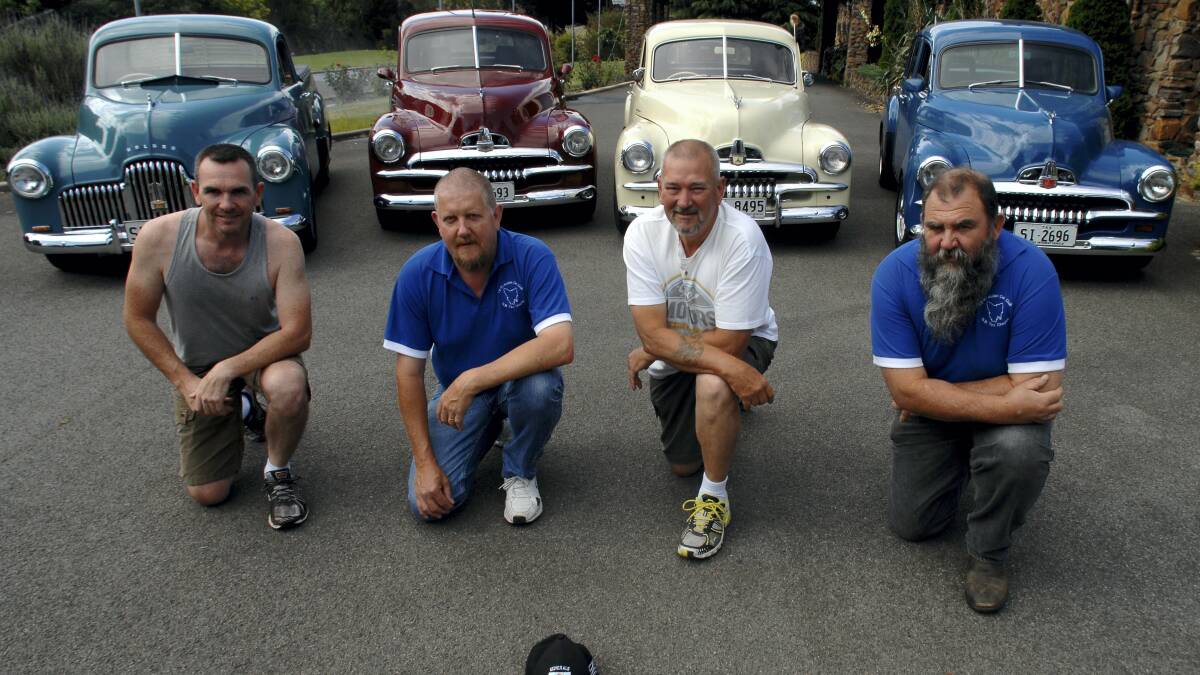 Danny Scott, of South Australia, and David Jackson,  Neil Wells and Shane Fitch, all of Launceston, with the FX and FJ Holdens that will be among those on display at Royal Park on Sunday in  an Australian Early Holden Federation rally.