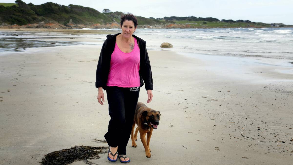 Allison Nicholls takes a walk on the windswept Marrawah beach where she used to go with her partner Simon Crisp. Picture: GEOFF ROBSON