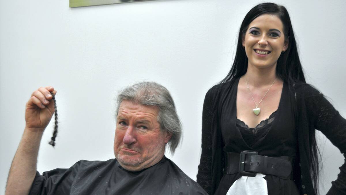 Howard Colvin, of Bridgenorth, rues the loss of his ponytail, which was cut off by Hair Maids owner Josie Wroblewski . . . for a good cause. Picture: EMILY BAKER