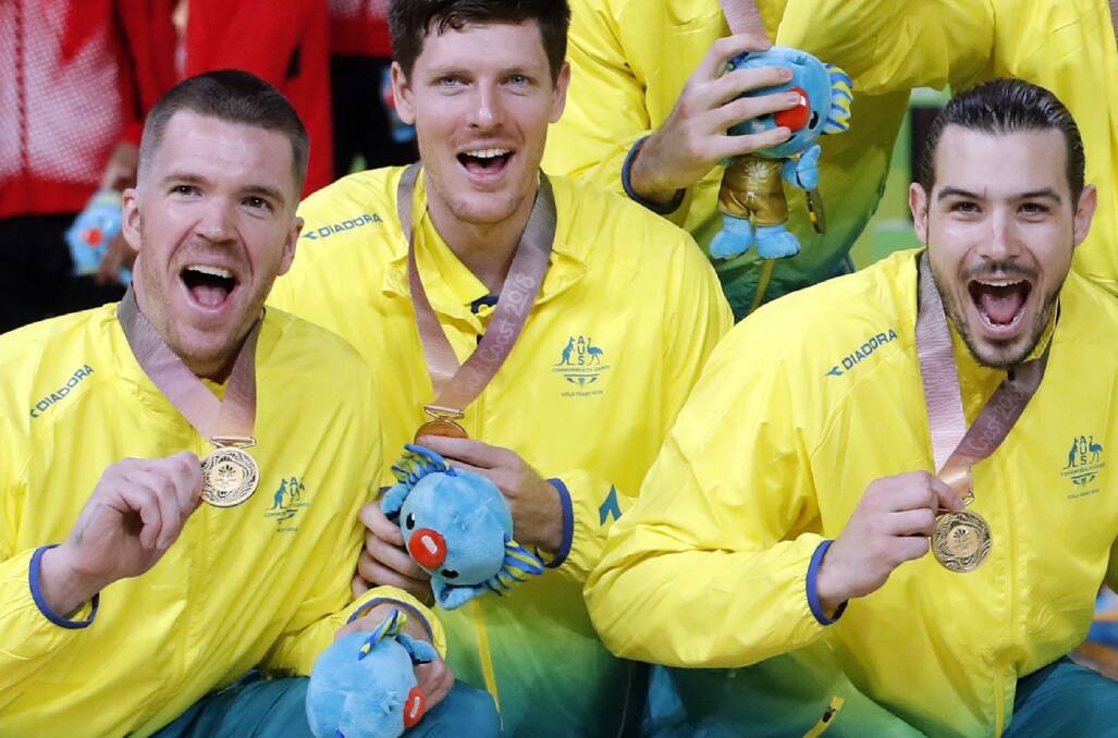Green and gold: Lucas Walker (left) celebrates with his Commonwealth Games gold medal after the Boomers' triumph on the Gold Coast. Picture: AAP