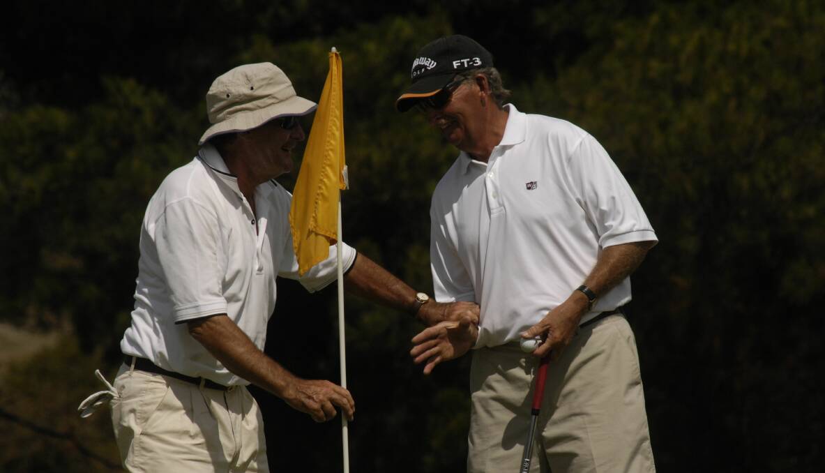 Tassie champ: Duncan Grant congratulates playing partner Mike Leedham at the Tasmanian Amateur Golf Championships in 2007.