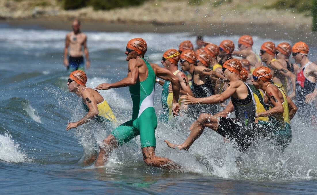 Call my Bluff: Competitors hit the water in the Devonport Triathlon.