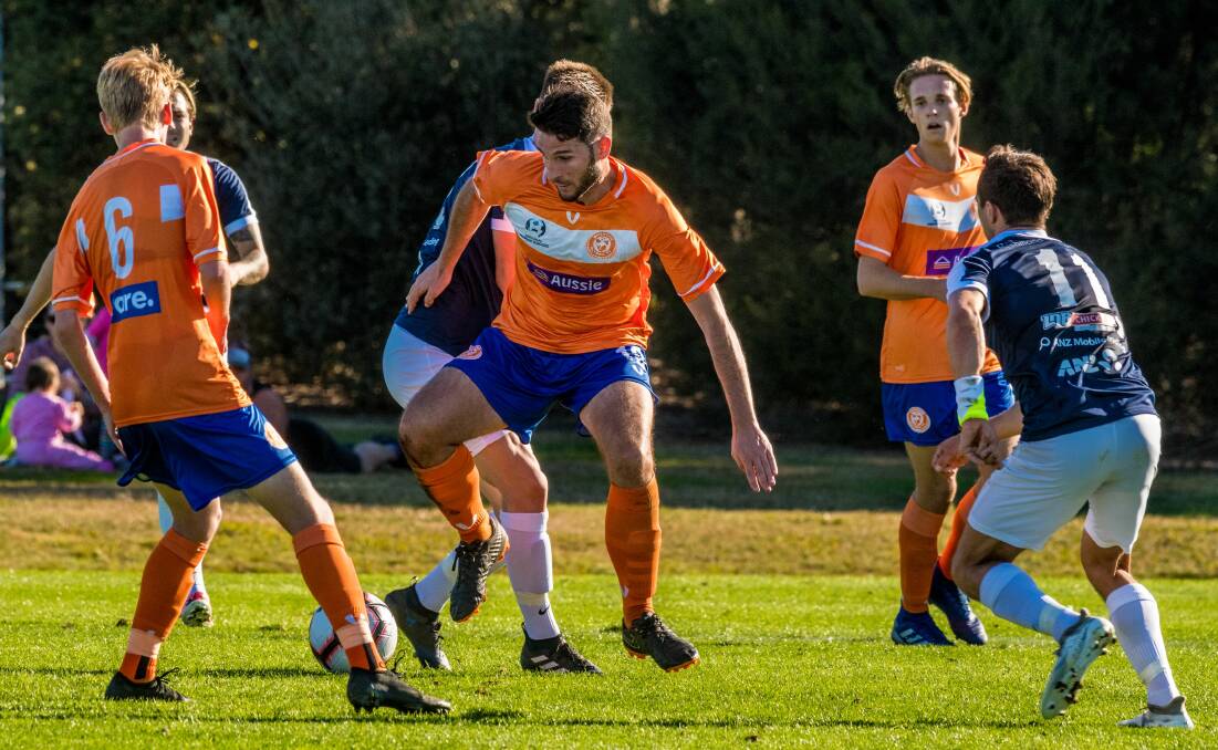 Orange squash: Riverside's Jonathon O'Neill leading the line against South Hobart last month. Picture: Phillip Biggs