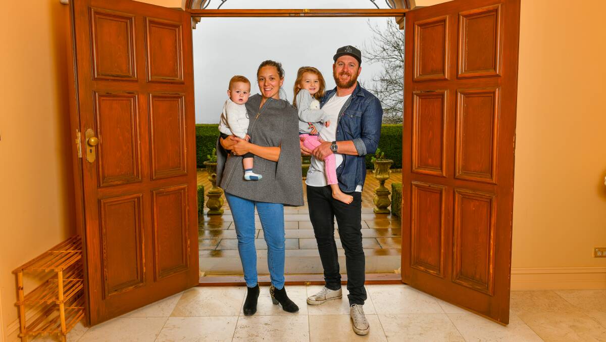 Welcome home: Retired professional cyclist Matt Goss with his wife Sarah, son Ari and daughter Zuri. 
Picture: Scott Gelston