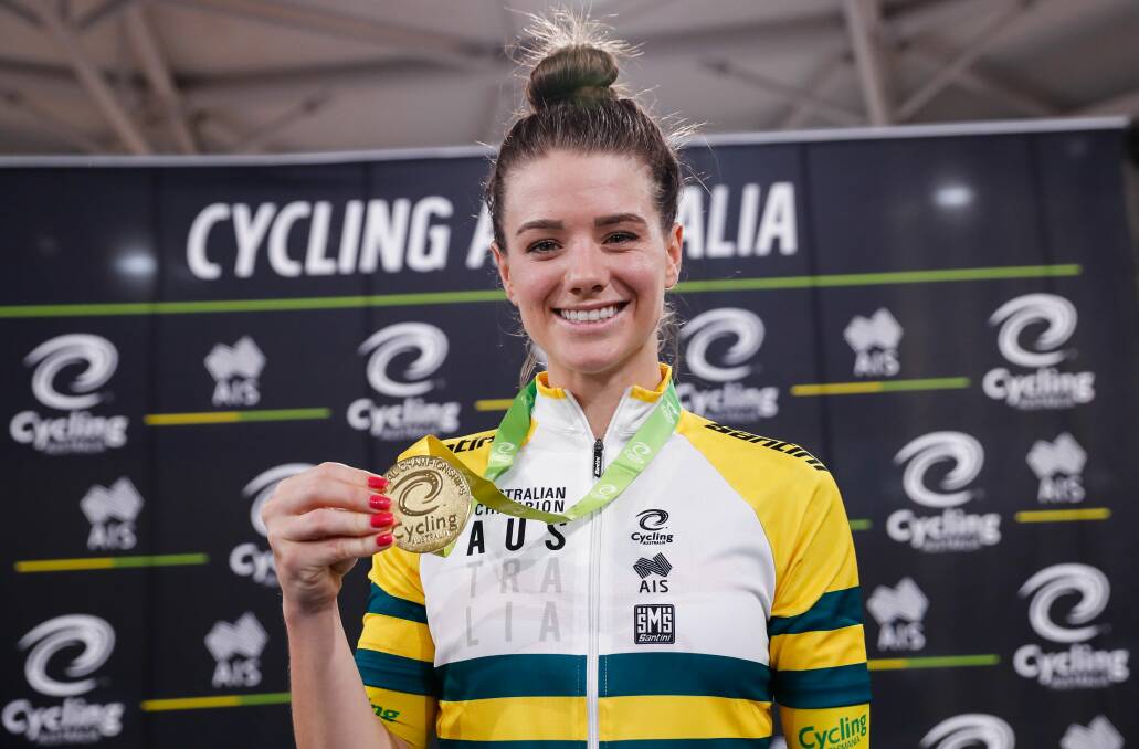 Amy Cure with one of her many track cycling medals. Picture: Con Chronis